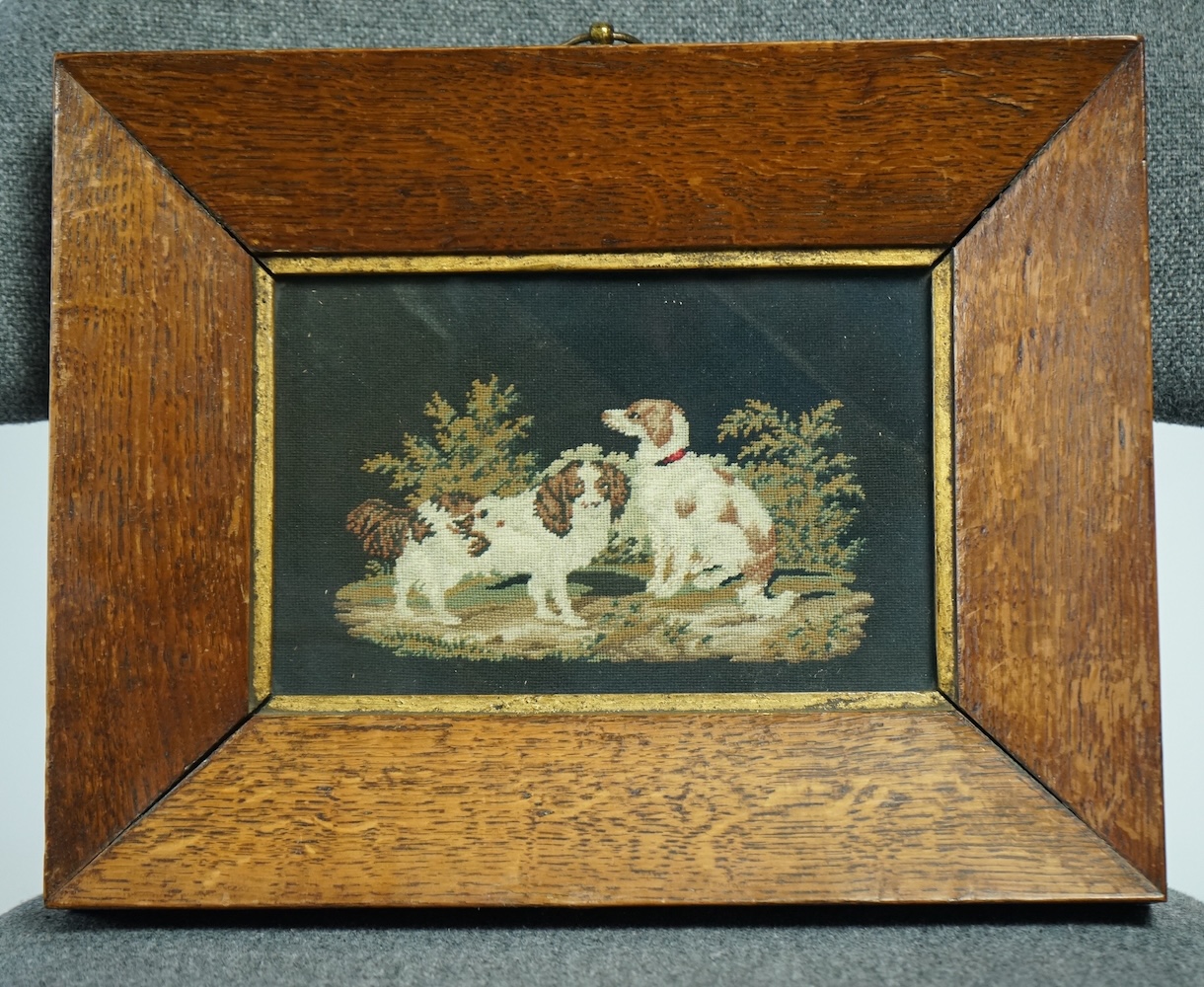 A framed 19th century finely worked petite point embroidery of two Spaniels within a bushy landscape.19.5cm wide x 12.5 cm high. Condition- good